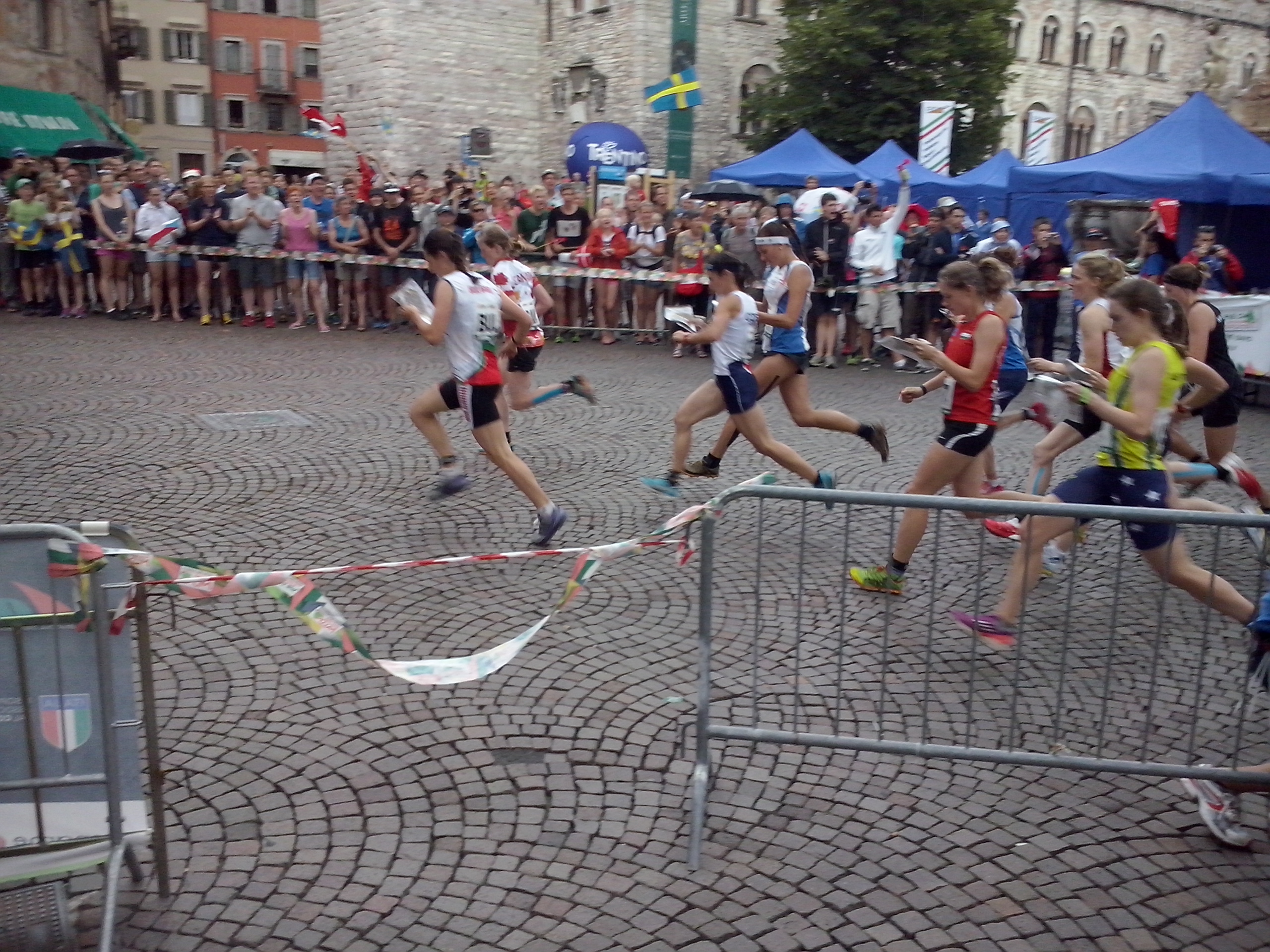 Sport events are not just important for public health, they're also threads that bring the society together in a common pursuit. (Photo: World Orienteering Championships 2014 Sprint Relay in Trento, Italy)